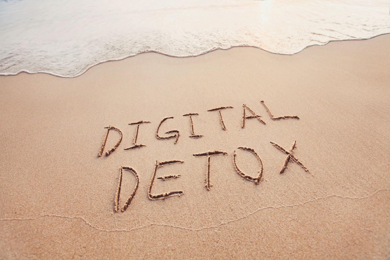 Digital Detox written on beach