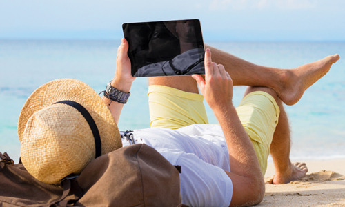Man with head on the beach