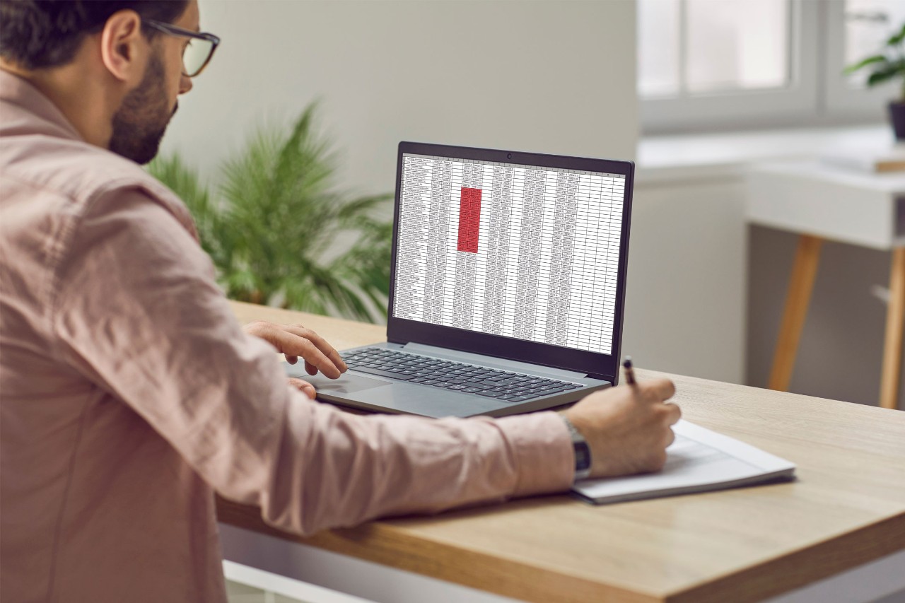 Man working in excel on computer