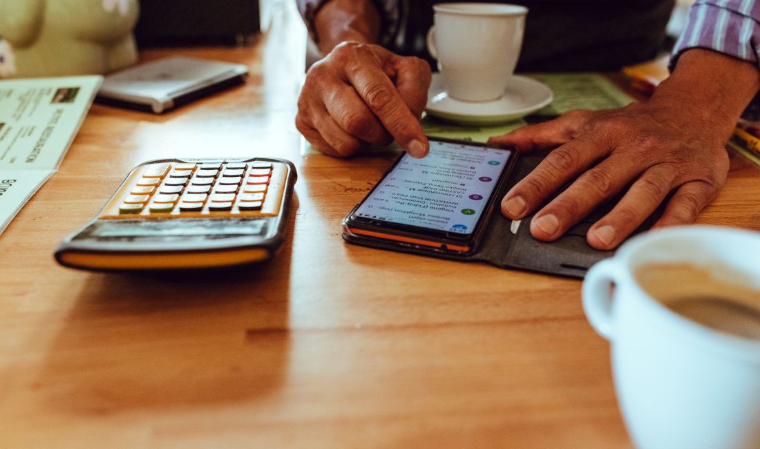 mobile phone and calculator on the table